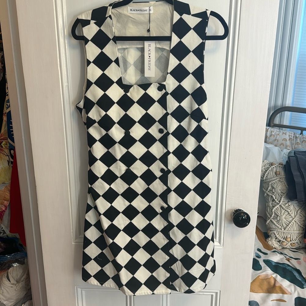 Mod style black and white button up sleeveless mini dress